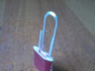 gently insert a paper clip into the received 