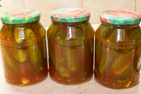 Cucumbers with ketchup chili for the winter in banks