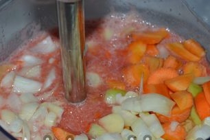 Sliced vegetables in a blender