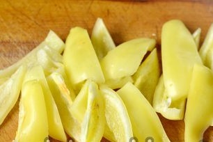 chop the peppers lengthwise and set aside in a separate bowl