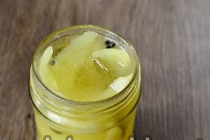 put peppers in a jar and fill with marinade