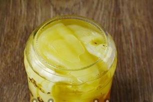 put vegetables and fruits in clean and dry jars, alternating them and fill with brine, roll up lids