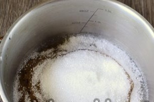 pour plums with sugar