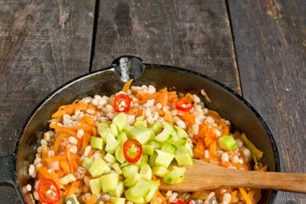 put cucumbers and chili in a pan