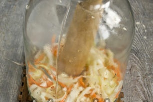 put a layer of cabbage in a jar