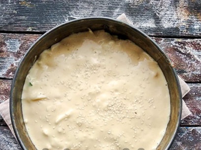 pour the dough and sprinkle with sesame seeds