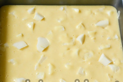 pour the dough into the mold, put the apples