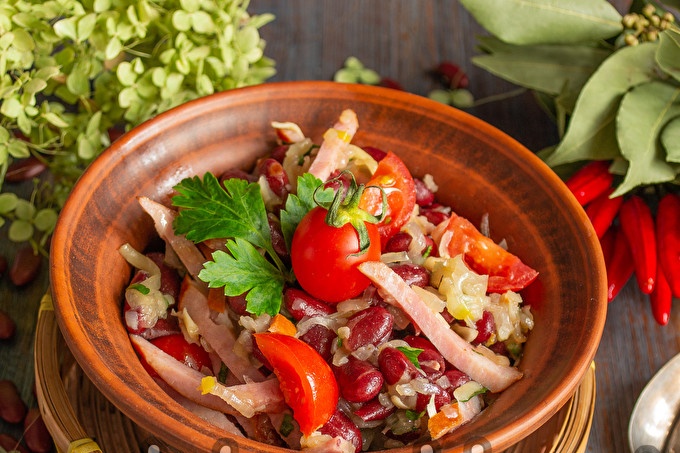 Obzhorka salad with beans and smoked sausage