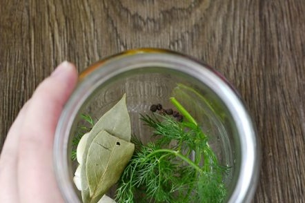 spices, dill and garlic in a jar