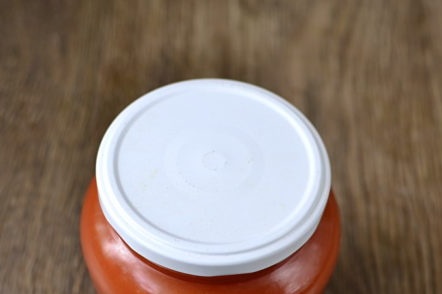 ketchup of plums and tomatoes in a jar