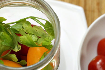 put tomatoes in half the jar