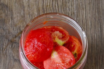 put the tomatoes in the jars