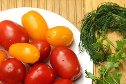 cooking tomatoes and greens