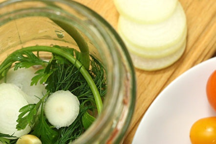 greens and garlic in a jar