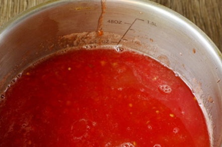 mashed tomatoes in mashed potatoes